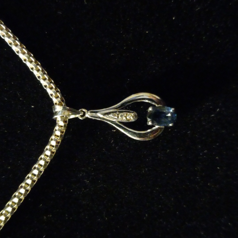 18" 925 ITALY box chain. Marked. With a 4K white Gold pendant CZ and blue gem.